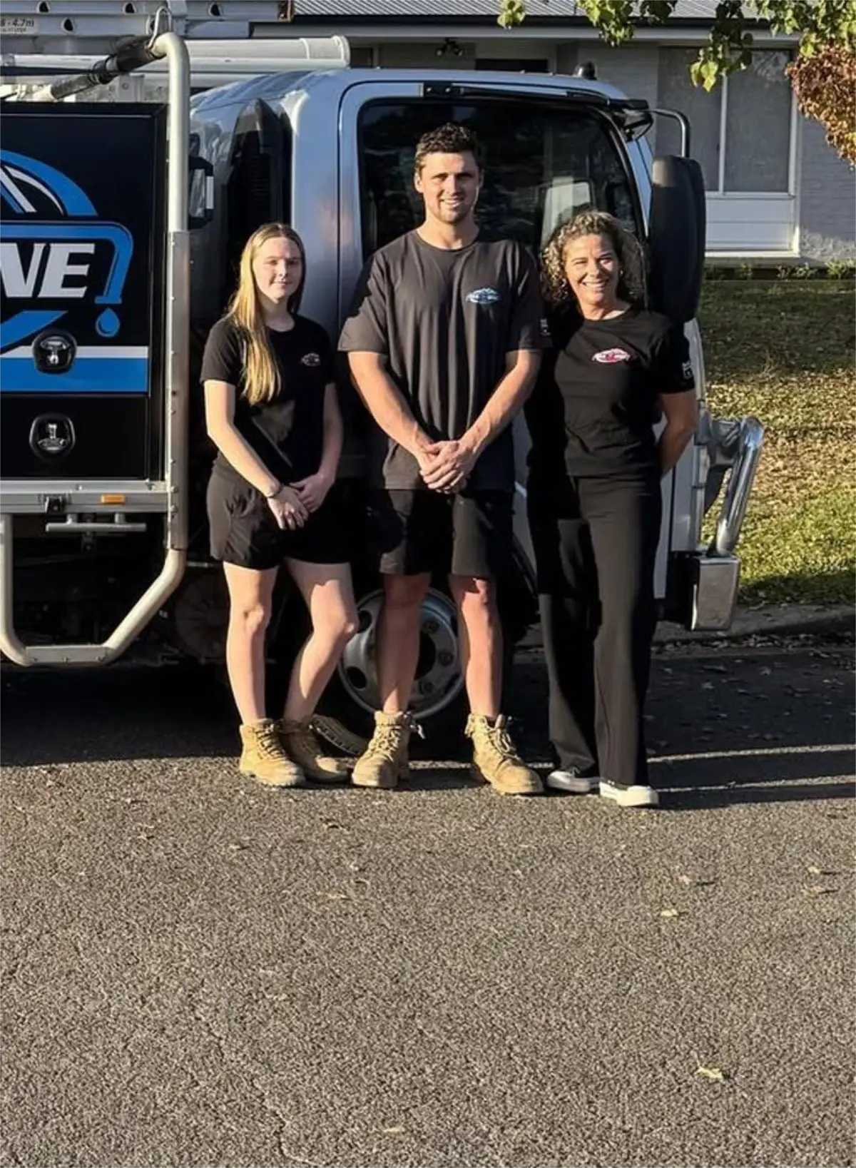 The Plumber Western Sydney team standing beside their work vehicle